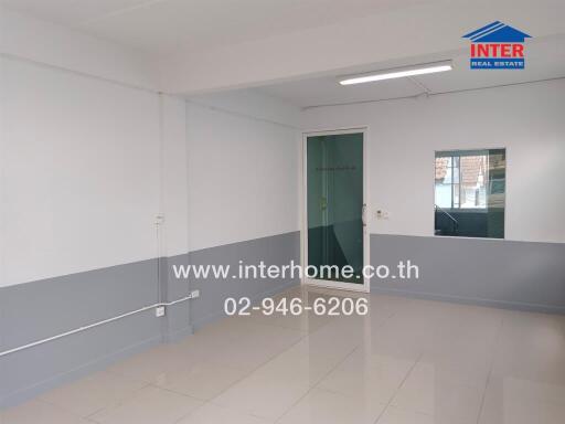 empty room with tiled floor and white-gray paint