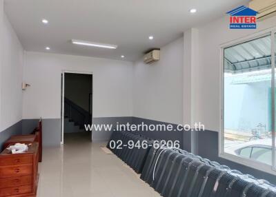 Spacious living room with modern lighting and air conditioning