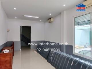 Spacious living room with modern lighting and air conditioning