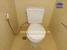 Bathroom with toilet and bidet spray