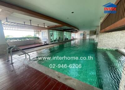 Indoor swimming pool with adjacent gym area