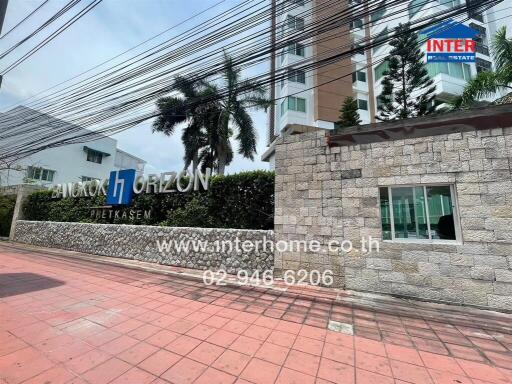 Apartment building entrance with Inter Real Estate signage