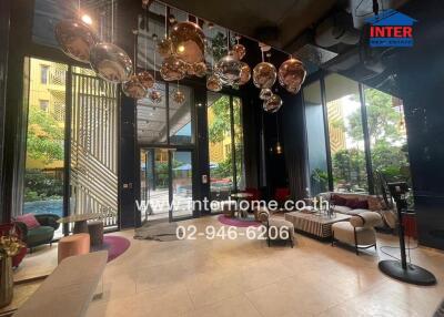 Modern lobby with seating area and decorative lighting