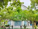 Exterior view of a building with lush green garden