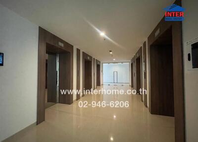 Apartment building hallway with elevators