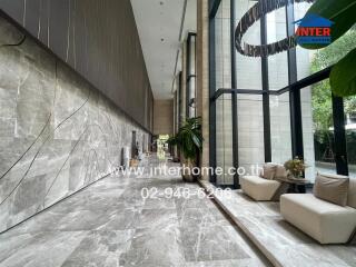 luxurious building lobby with large windows and modern decor