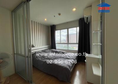 Bedroom with large window and modern decor
