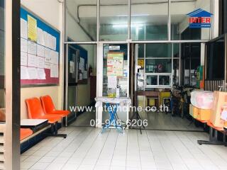 Building lobby or waiting area with chairs and notice boards