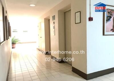 Apartment hallway with elevator and intercom system