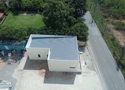 Aerial view of a newly constructed building near a road