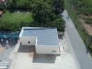 Aerial view of a newly constructed building near a road