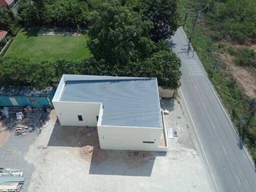 Aerial view of a newly constructed building near a road