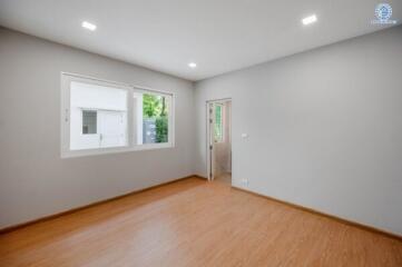 Spacious empty bedroom with large window
