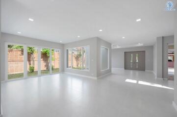 Spacious and bright living area with large windows