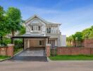 Modern two-story house with a carport and garden