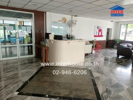 Lobby area with reception desk and seating