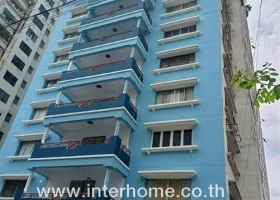 Exterior view of a blue residential building