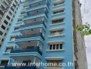 Exterior view of a blue residential building