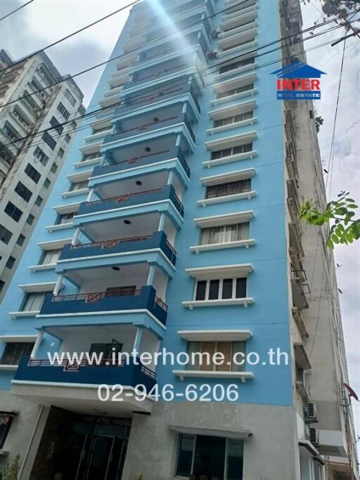 Exterior view of a blue residential building