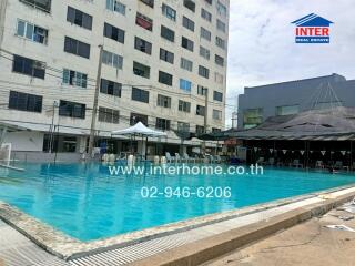 Apartment building exterior with swimming pool