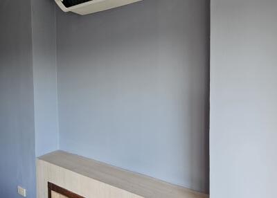 Wall-mounted air conditioner in a room