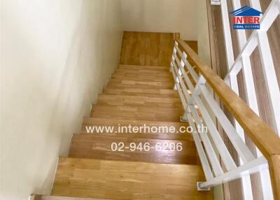 Wooden stairs with white railings