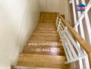 Wooden stairs with white railings