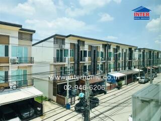 Street view of residential buildings with multiple floors