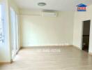 Main living area with wood flooring and air conditioning