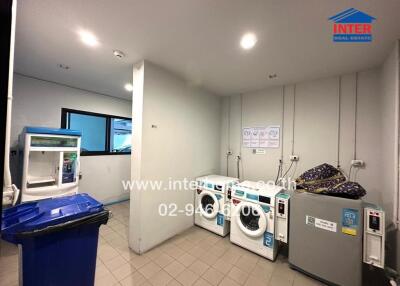 Laundry room with washing machines and space for storage