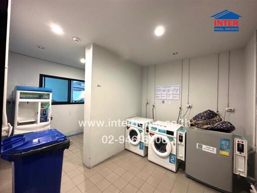 Laundry room with washing machines and space for storage