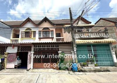 Front view of a residential building with a street view