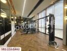 Gym with modern equipment and large windows