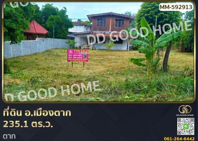 Land plot for sale with house in the background