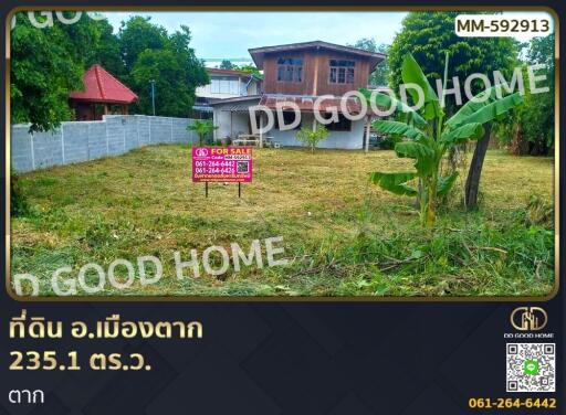 Land plot for sale with house in the background