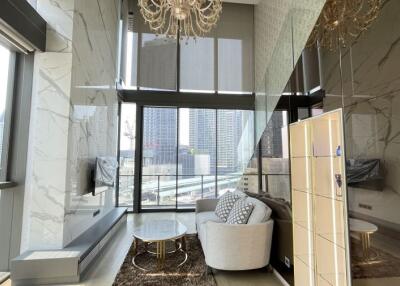 luxury high-rise living room with floor-to-ceiling windows