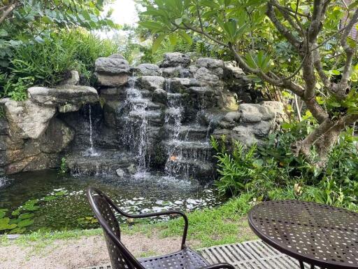 Garden with a water feature and seating area