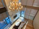 Spacious and elegant living room with chandelier and floor-to-ceiling windows