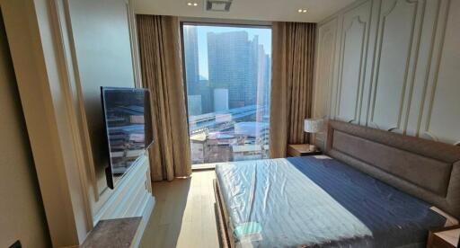 Modern bedroom with large window and city view