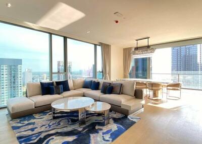 Spacious living room with modern furniture and a large window view