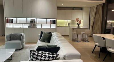 Modern open plan living room and kitchen with stylish furniture and decor