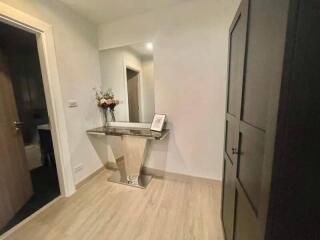 Hallway with a modern console table and flowers