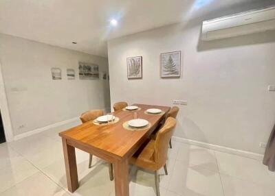 Dining area with wooden table and chairs