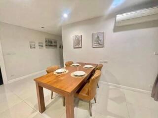 Dining area with wooden table and chairs
