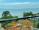 Balcony view overlooking the sea and city skyline