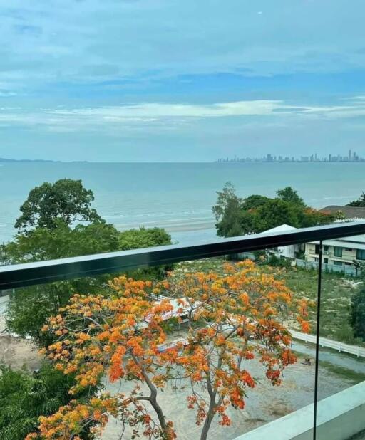 Balcony view overlooking the sea and city skyline