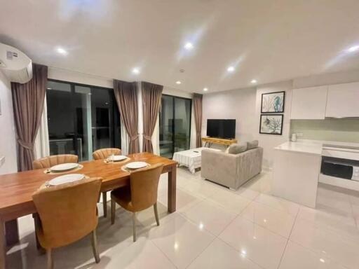 Modern living room with dining area and kitchen