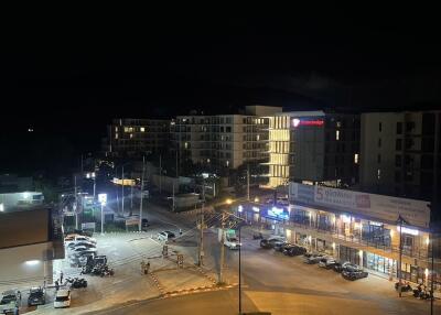 Night view of buildings and street with cars