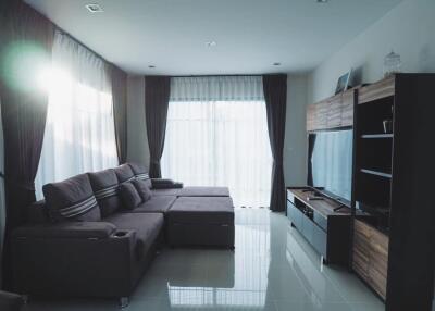 Modern living room with sectional sofa and entertainment unit