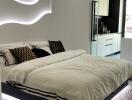 Modern bedroom with minimalist design, featuring a floating bed with LED lighting